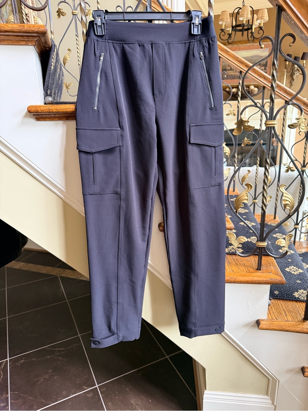 Athleta Never Worn Black Pant.Adjustable leg. Zipper pockets.Elastic waist. 6